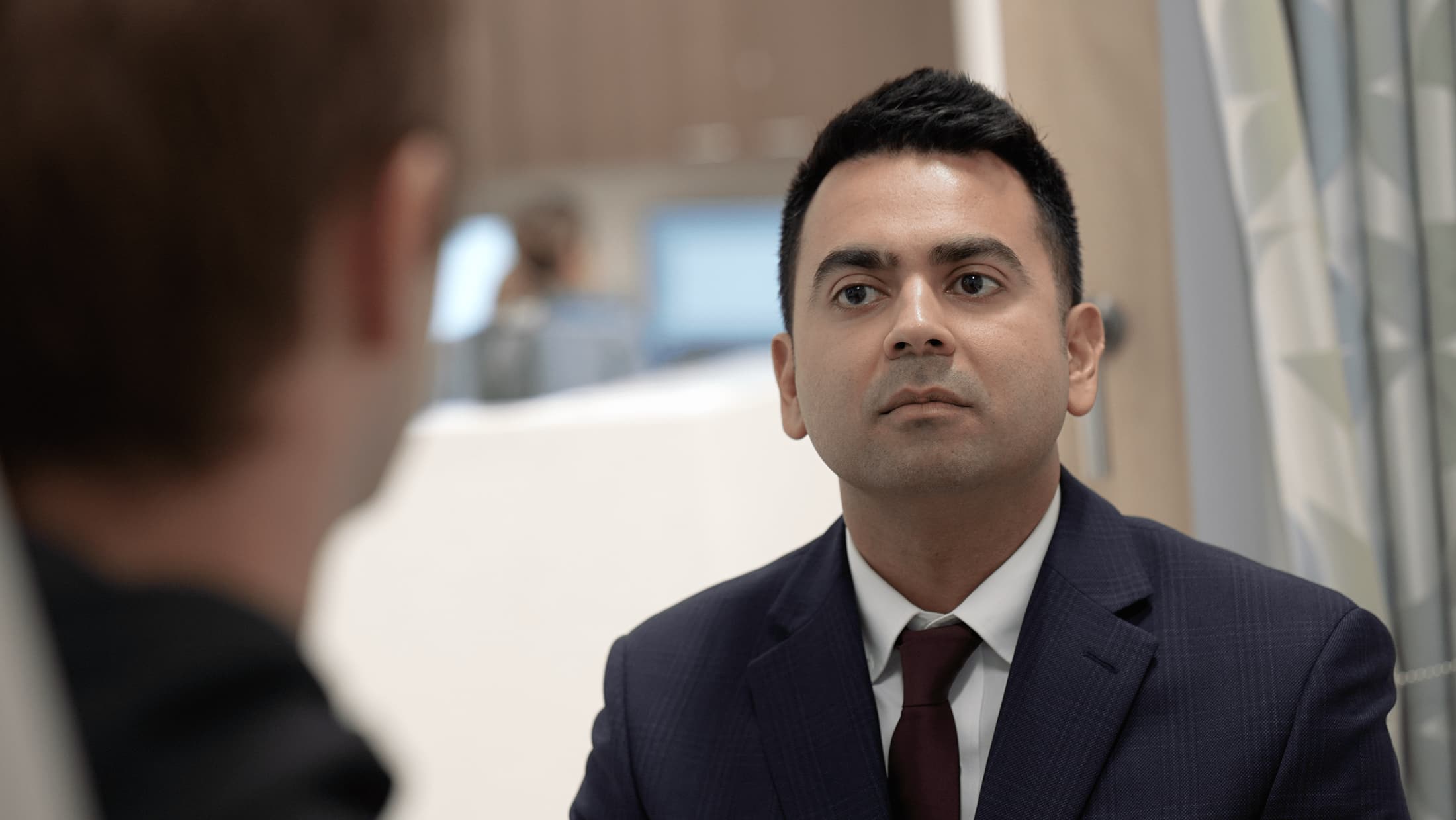 Dr. Hashmi in consultation with a patient